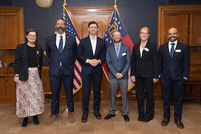 Ossoff photo (L-R): Leah Oliver, Nicholas Macias, Sen. Jon Ossoff, Aaron David, Jennifer Owen, and Sahas Barve