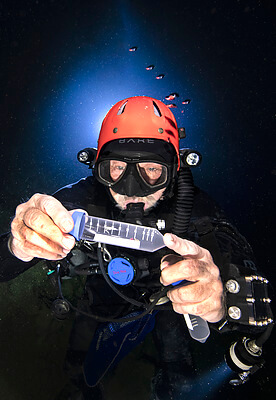 Dr. Thomas Illiffe collects a blind cave shrimp that could be a new species inside of Giant Cave Belize. The process is very unique and he's perfected it in an extreme environment. His work could show how organisms can survive in hash environments on other planets. Credit&#58; Becky Schott